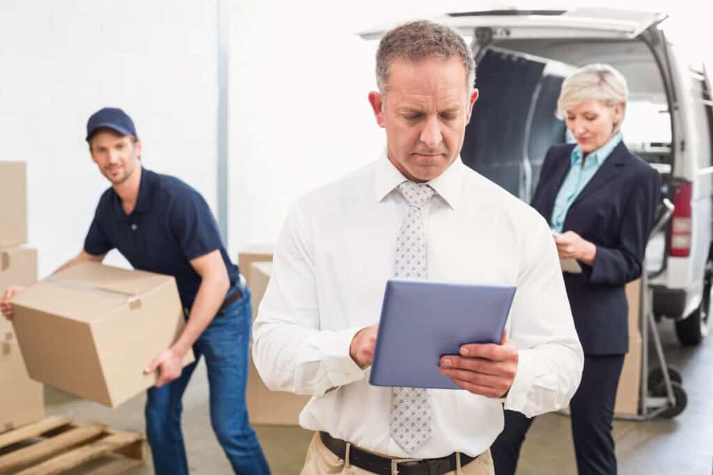 An office manager reviewing the checklist during the moving day