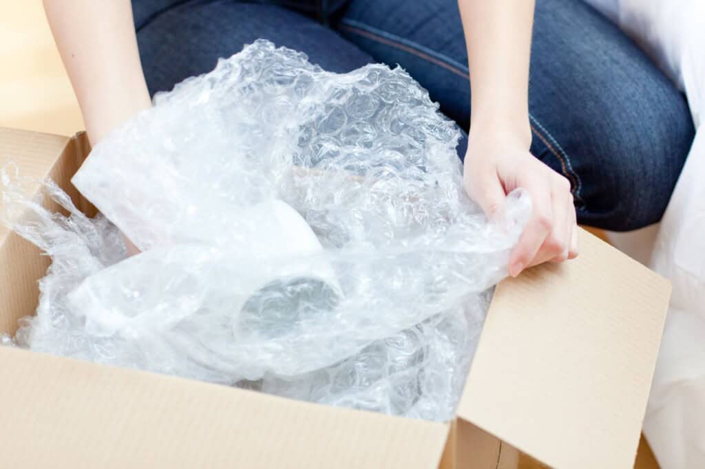 A woman unpacking a box