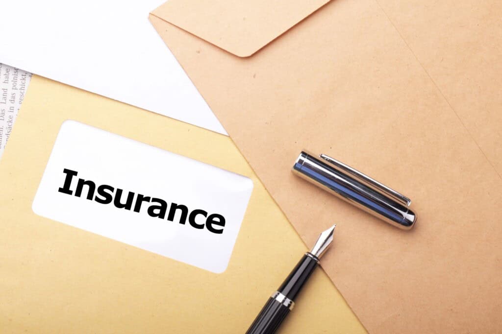 An insurance envelope on top of a table