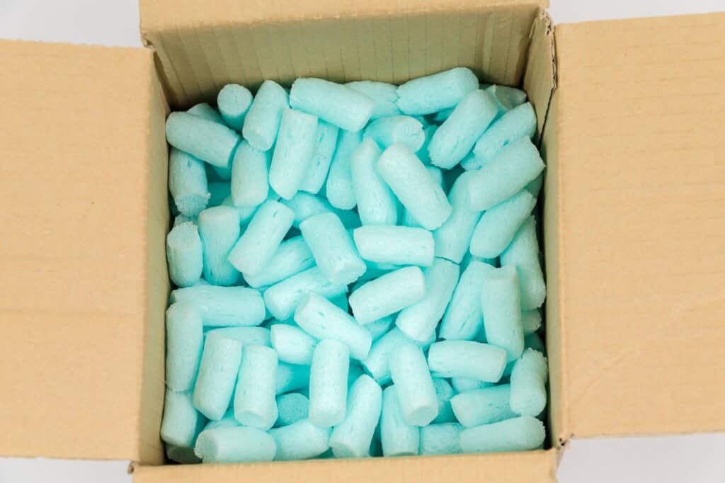 Blue-coloured styrofoam pellets inside a box