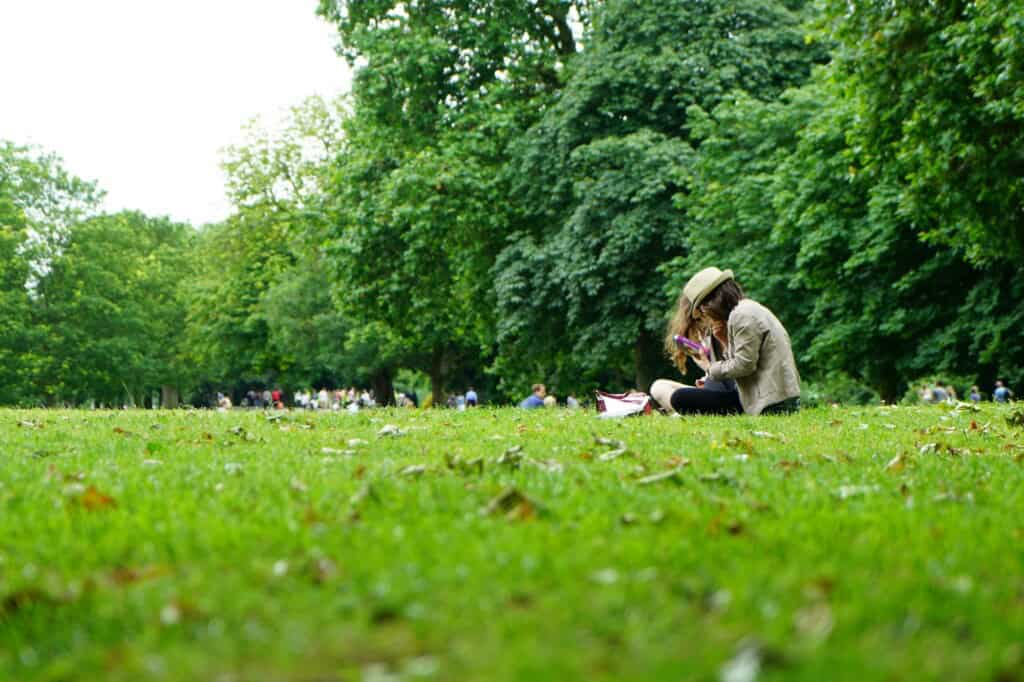 People sitting on a green field