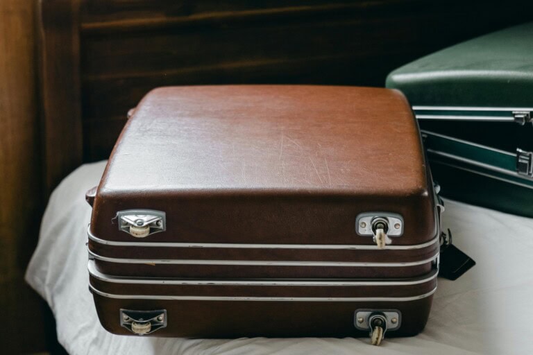 Two suitcases containing essential items for the moving day in the concept of moving to Bromley