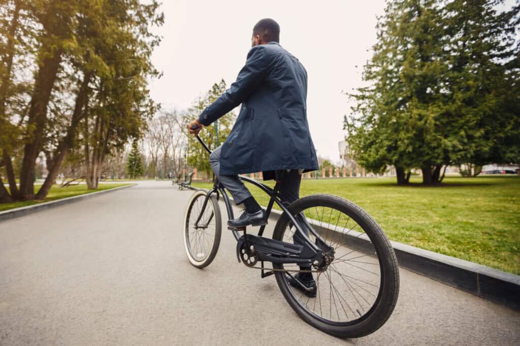 A businessman riding a bicycle going to work