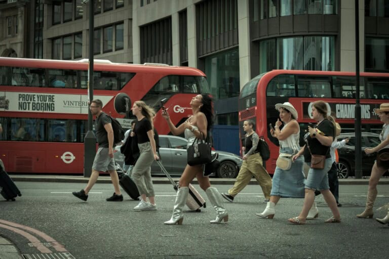 Double-decker buses and pedestrians in the concept of 'how to use Bromley's public transport'.