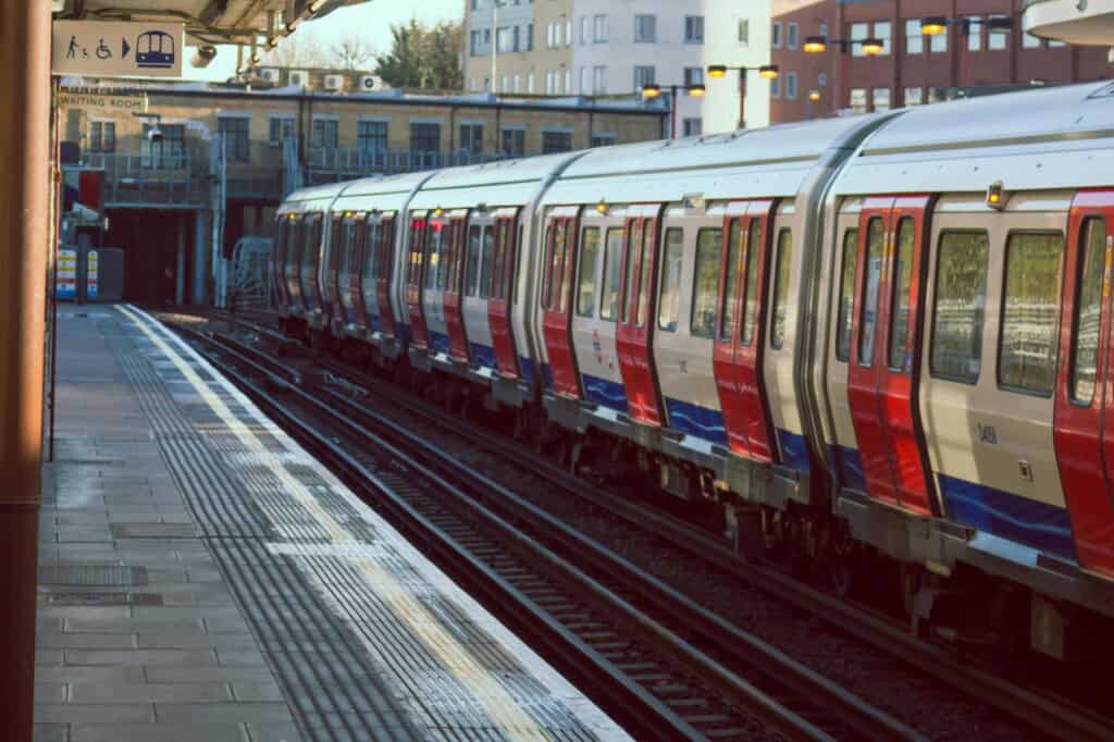 An Underground train picking up passengers